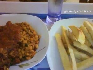 Beans porridge and fried yam with a pglass of water hmmmn! [proudly Nigerian]